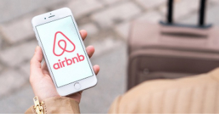 airbnb home share logo on a smart phone